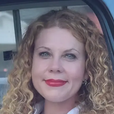 A profile picture of Beth Pugh Farrell.