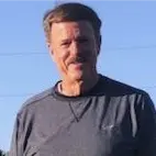 A profile picture of Kent Whitaker.