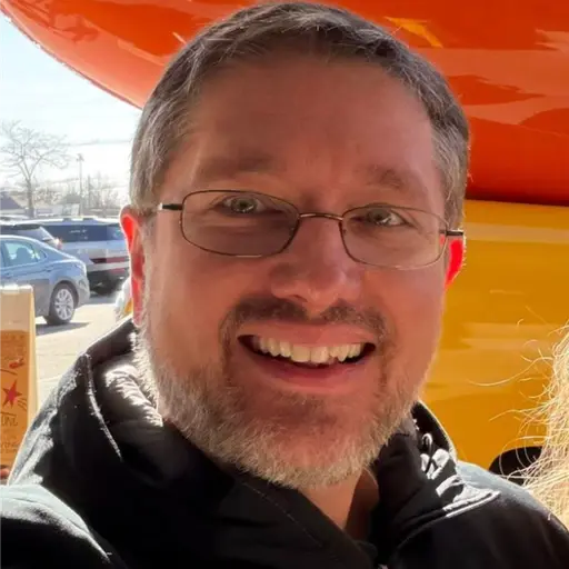A profile picture of Mark Blum.