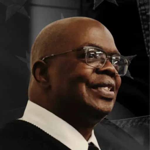 A profile picture of Dennis Morris Allen.