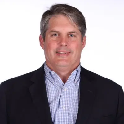 A profile picture of Tom Sell.