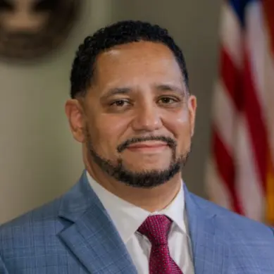 A profile picture of Carlos D'Angelo Bailey.