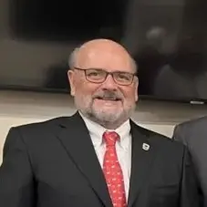 A profile picture of John B. Clark.