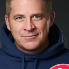 A profile picture of Paul Hallinan Miller.