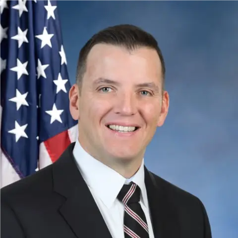 A profile picture of Patrick Carroll.