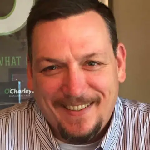 A profile picture of Todd Stone.