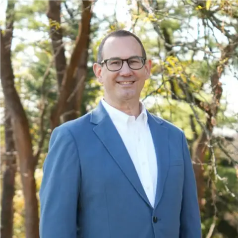 A profile picture of Mark Pinsley.